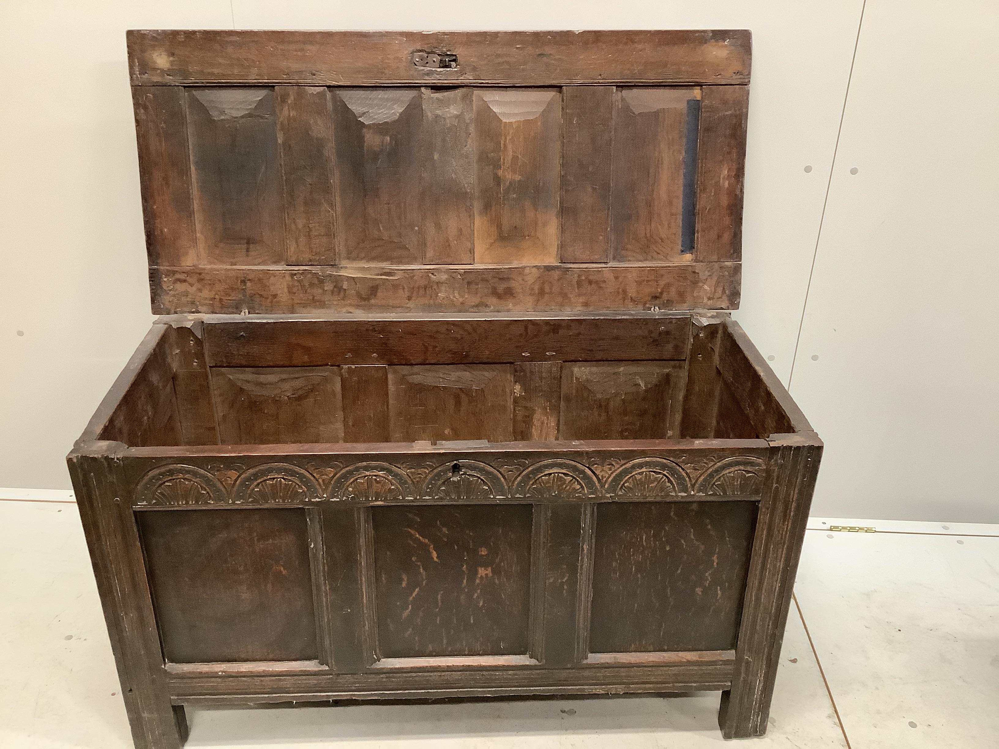 An 18th century panelled oak coffer, width 118cm, depth 54cm, height 66cm